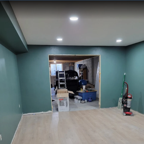 Testimonial photo from a client showing recess lighting in a basement