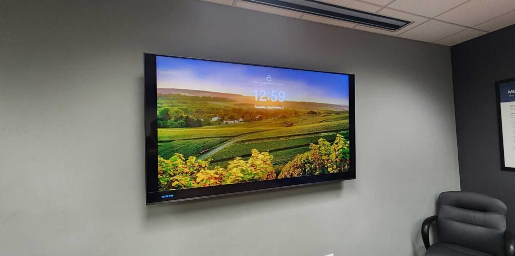 A photo of a commercial TV installed with a professional floating mount